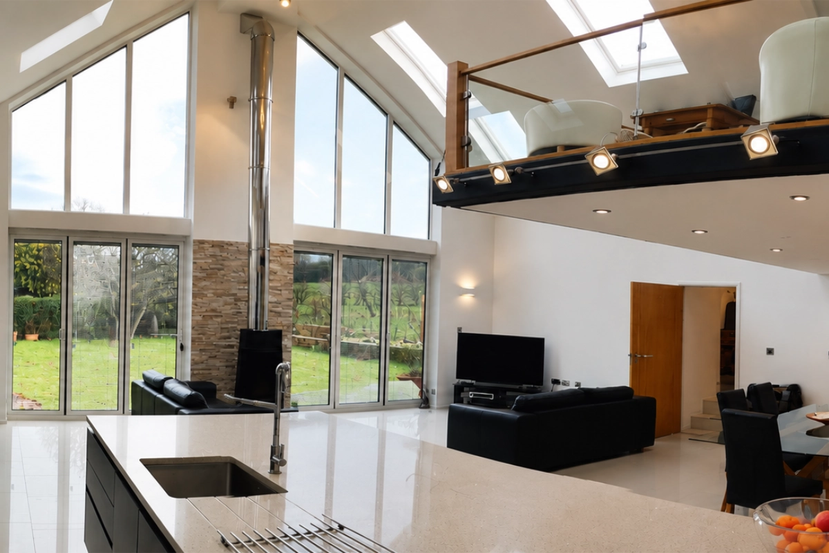 Modern open-plan home extension with mezzanine, large windows and bi-fold doors